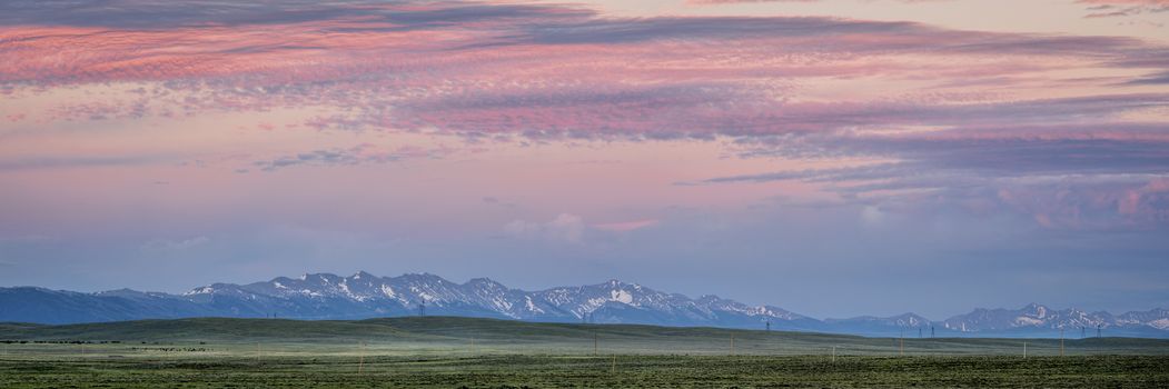 panorama of Medicine Bow Mountains at dusk in early summer, North Park, Colorado near Cowdrey