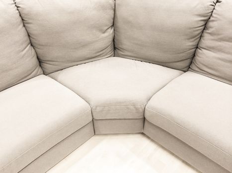 Luxurious white corner sofa. Modern style furniture.