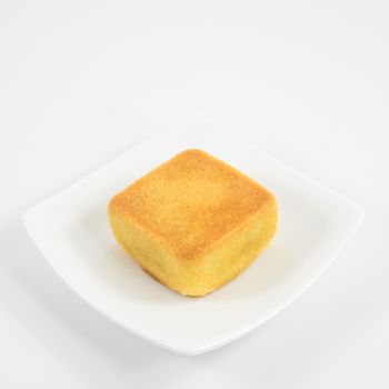 The tasty Taiwanese pineapple pastry cake on the small white square dish.