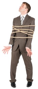 Businessman with briefcase and tied with rope screaming