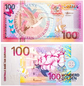 Banknote 100 Gulden Suriname front and back isolated on white emitted on 2000. Long talled hermit on front and a flower on back