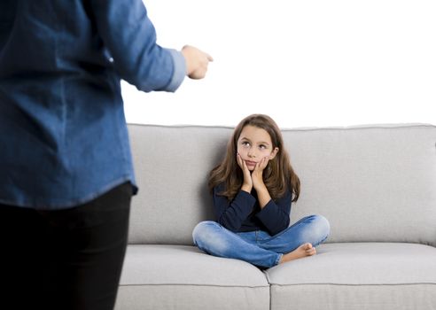 Grown up rebuking a little child for bad behavior