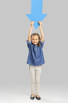 Beautiful little girl holding a arrow card