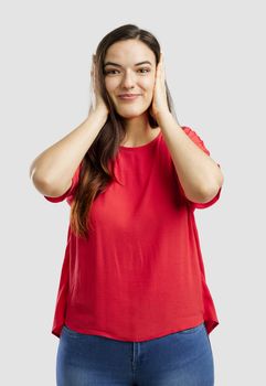 Lovey woman covering her ears with hands