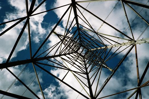 Film image of steel pylon with high voltage distribution powerlines
