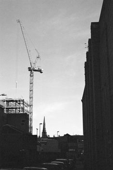 Black and white film image of a construction site