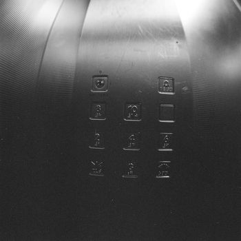 Black and white film image of elevator's key pad