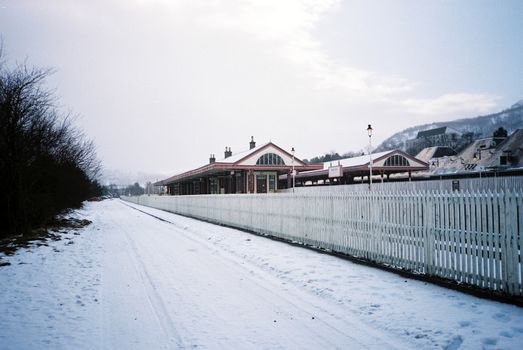 Color film image of train station in Aviemore