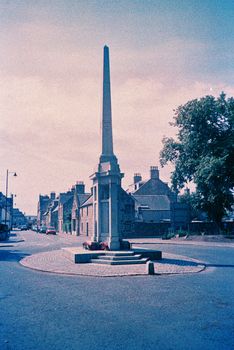 Color film image of city memorial in Huntly