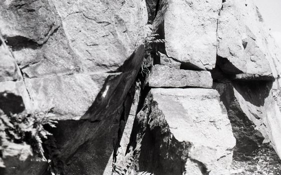 Black and white film image of rocks in Pass of Ballater