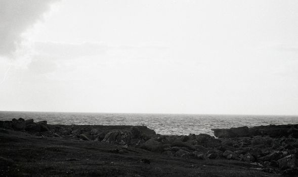 Black and white film image of the sea