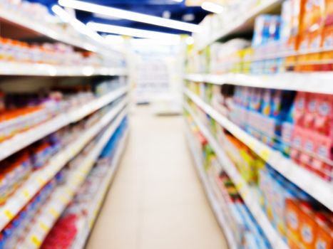 Baby foods jars in store. Blurred image as abstract background