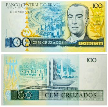 Banknote 100 Cruzados Brasil front and back isolated emitted on 1986. Electric power station on back, President Kubitschek