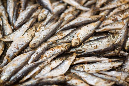 Fresh crispy fried Smelts in the pan. Close-up.