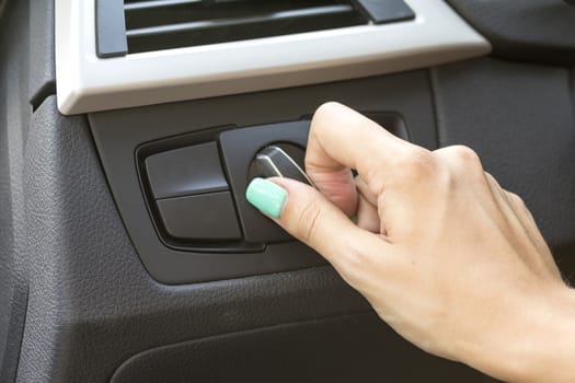 close-up of a girl's hand on the dashboard in a car