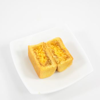 The tasty Taiwanese pineapple pastry cake on the small white square dish.