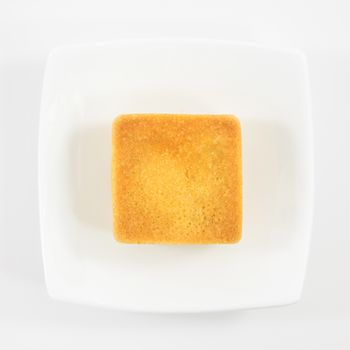 The tasty Taiwanese pineapple pastry cake on the small white square dish.