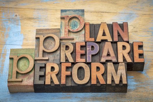 plan, prepare, perform  - motivational word abstract in vintage letterpress wood type