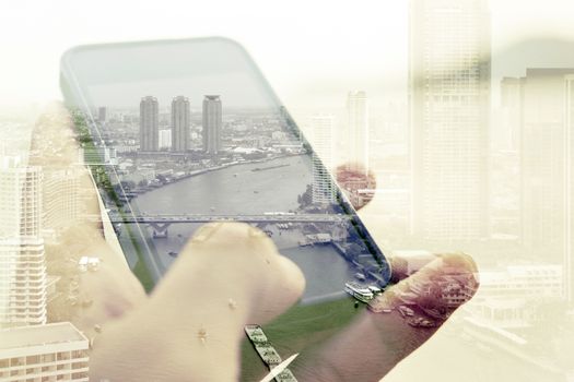 Double exposure image of people with smart phone and cityscape background