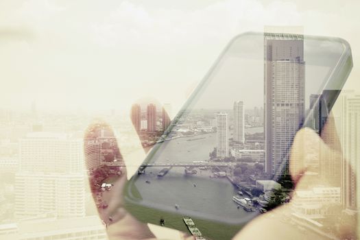 Double exposure image of people with smart phone and cityscape background