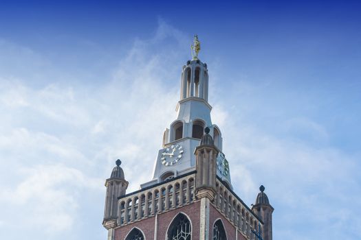 Artistic work of my own. HDR processing.
Old Historic Steeple with clock against a blue sky.