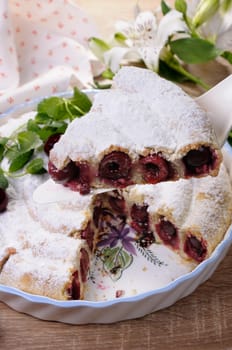 piece of cherry pie   sprinkled with sugar powder on the  shovel 