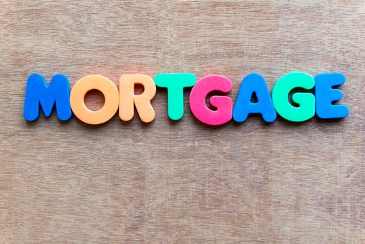 mortgage colorful word in the wooden background
