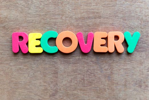 recovery colorful word in the wooden background