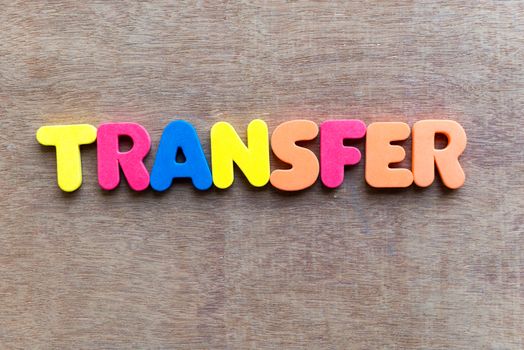 transfer colorful word in the wooden background