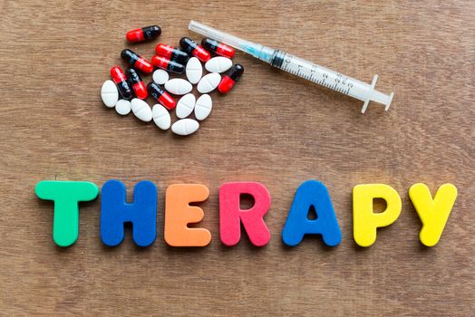 therapy colorful word in the wooden background