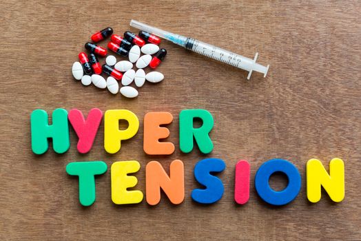 hypertension colorful word in the wooden background