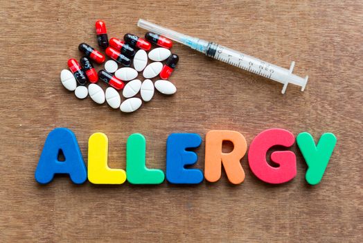 allergy colorful word in the wooden background