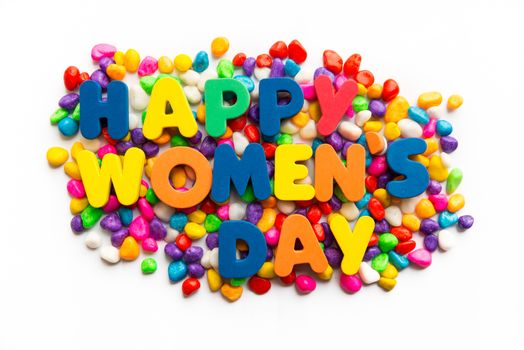 Happy Women's Day words on colorful stone