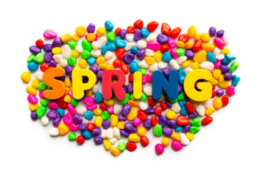 spring word on colorful stone