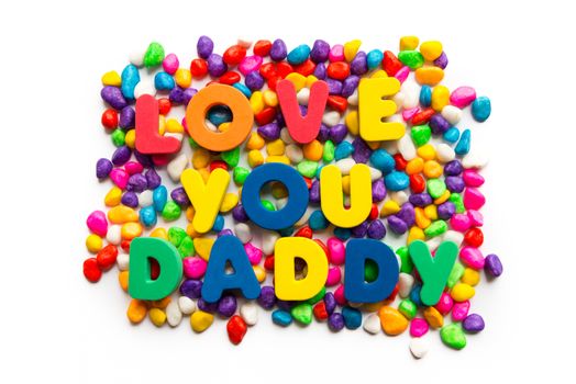 love you daddy words in colorful stones