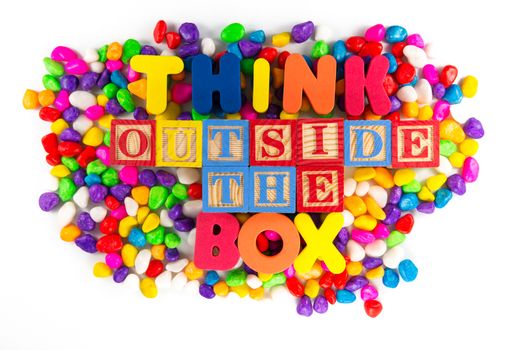 think outside the box word in colorful stone