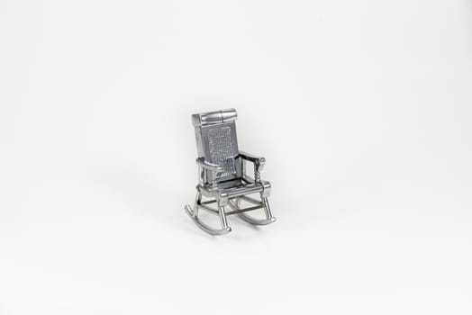 grey toy chair on the white background