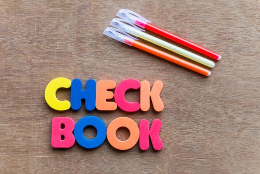 checkbook colorful word on the wooden background