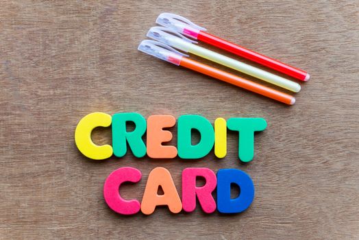 credit card colorful word on the wooden background