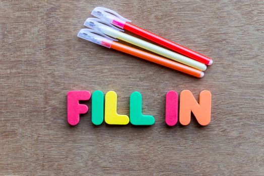 fill in colorful word on the wooden background