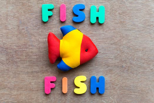 fish fish colorful word on the wooden background