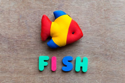 fish colorful word on the wooden background