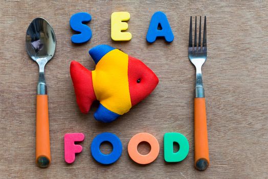 sea food colorful word on the wooden background