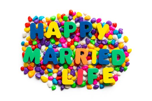 happy married life words on the colorful stone and white background