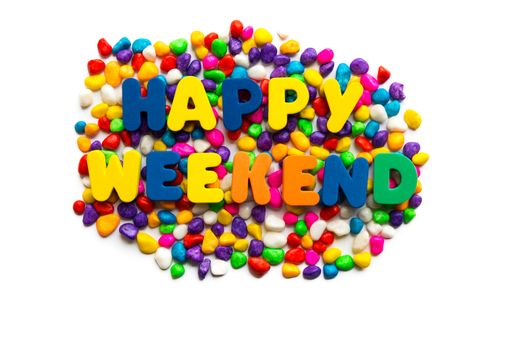 happy weekend words on the colorful stone and white background