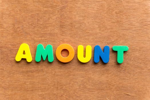 amount colorful word on the wooden background