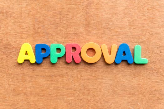 approval colorful word on the wooden background