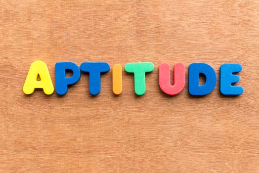 aptitude colorful word on the wooden background