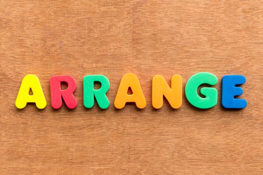 arrange colorful word on the wooden background