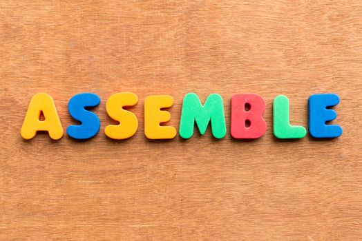 assemble colorful word on the wooden background